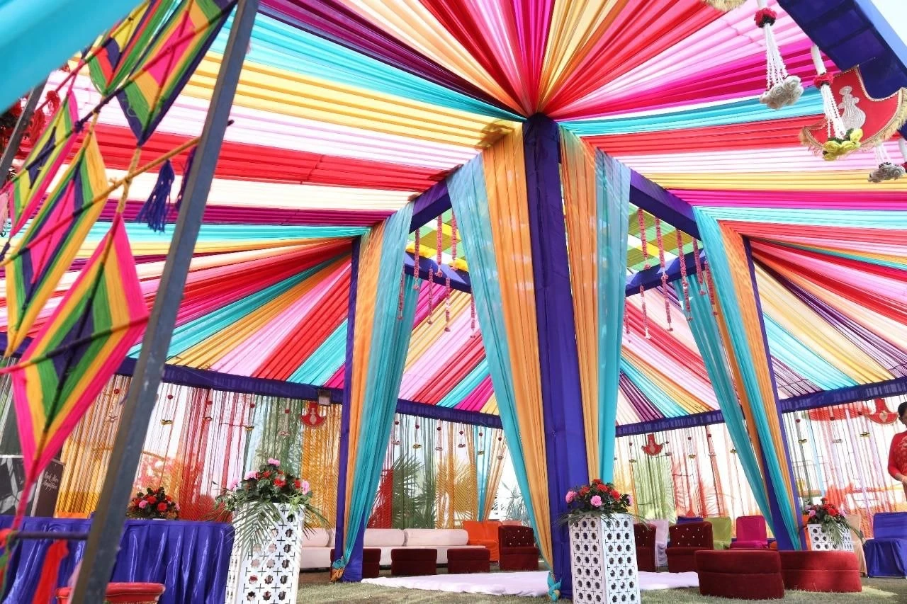 Colourful fabric canopy and lounge seating for a celebration