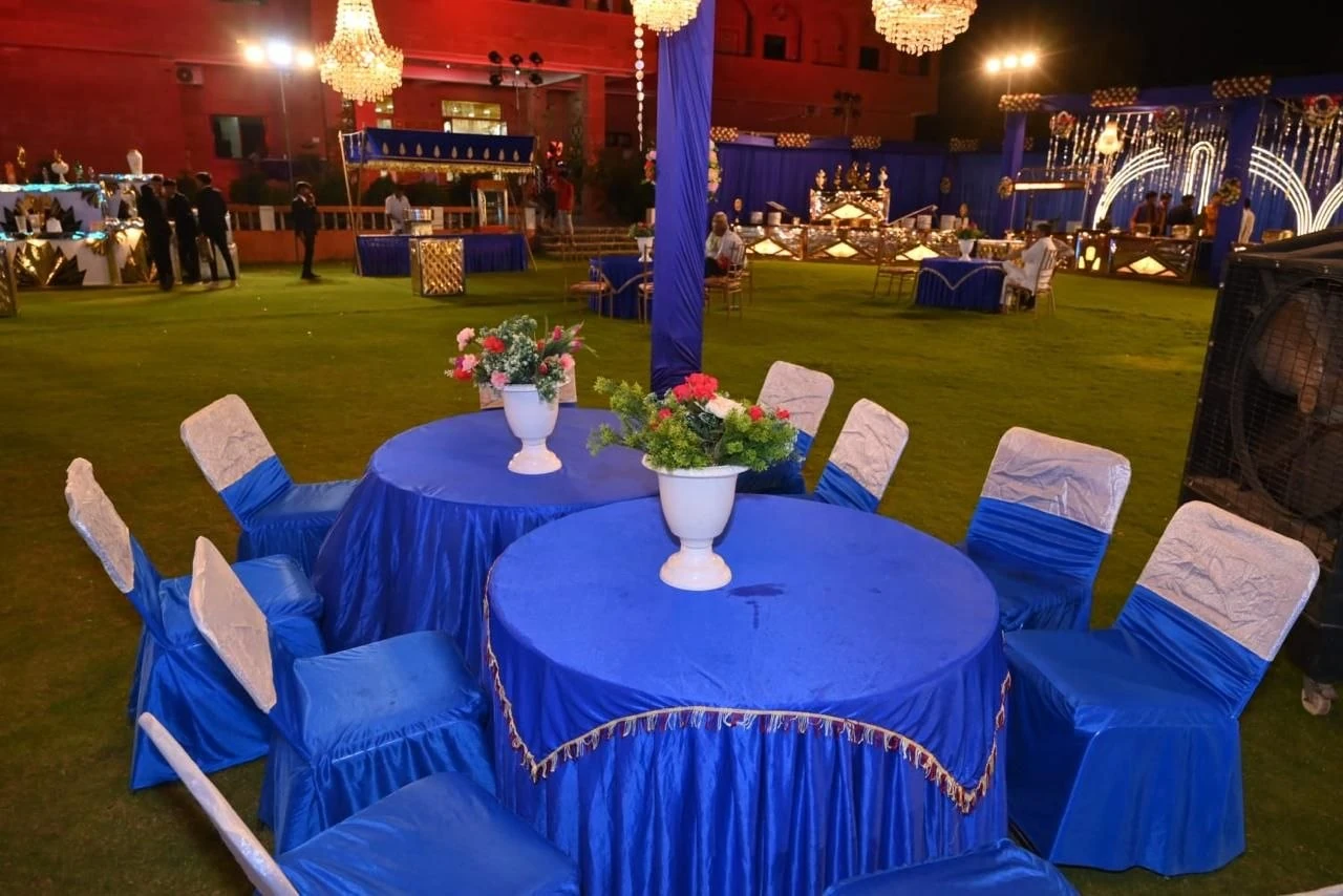 Blue table linen, coordinated seating and floral table arrangements